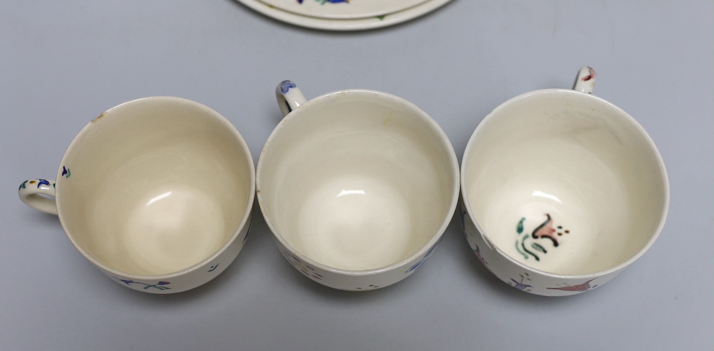 Jessie Marion King (1875-1949), four various floral design tea plates and three tea cups